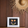 8x10 photograph of a banana smile with hibiscus eyes