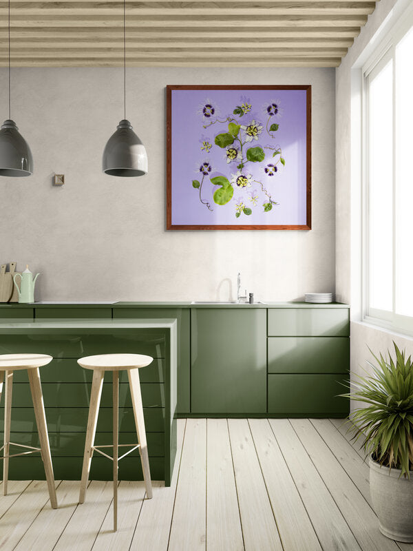 Modern kitchen with green cabinets, white stools, and a framed passion fruit or lilikoi floral artwork on the wall Hawaiian fine art photo Lola Pilar Hawaii