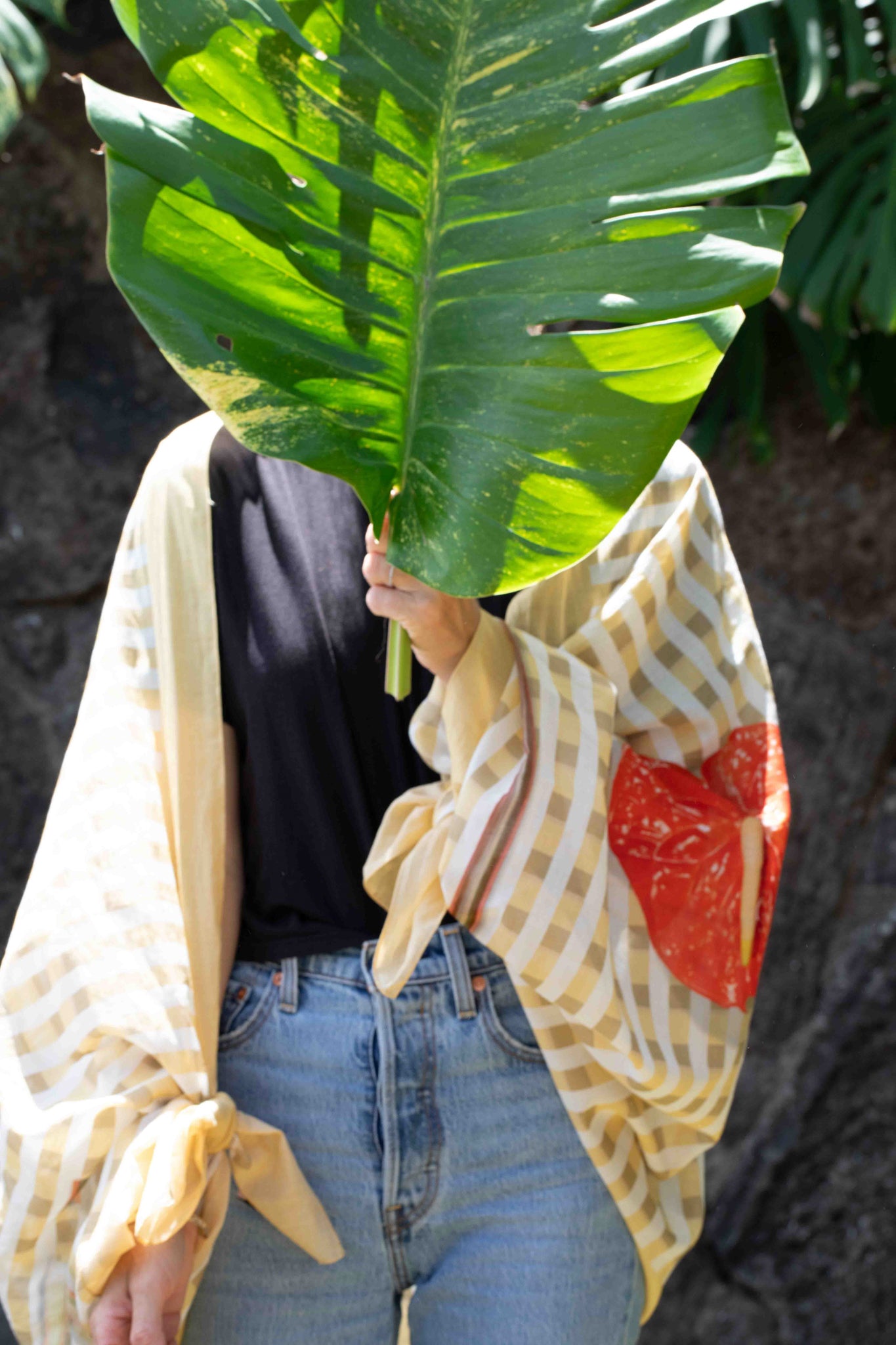 Beach sarong with yellow and white Hawaiian palaka check design, decorated with “I Love Hawaii” wording and tropical red anthurium