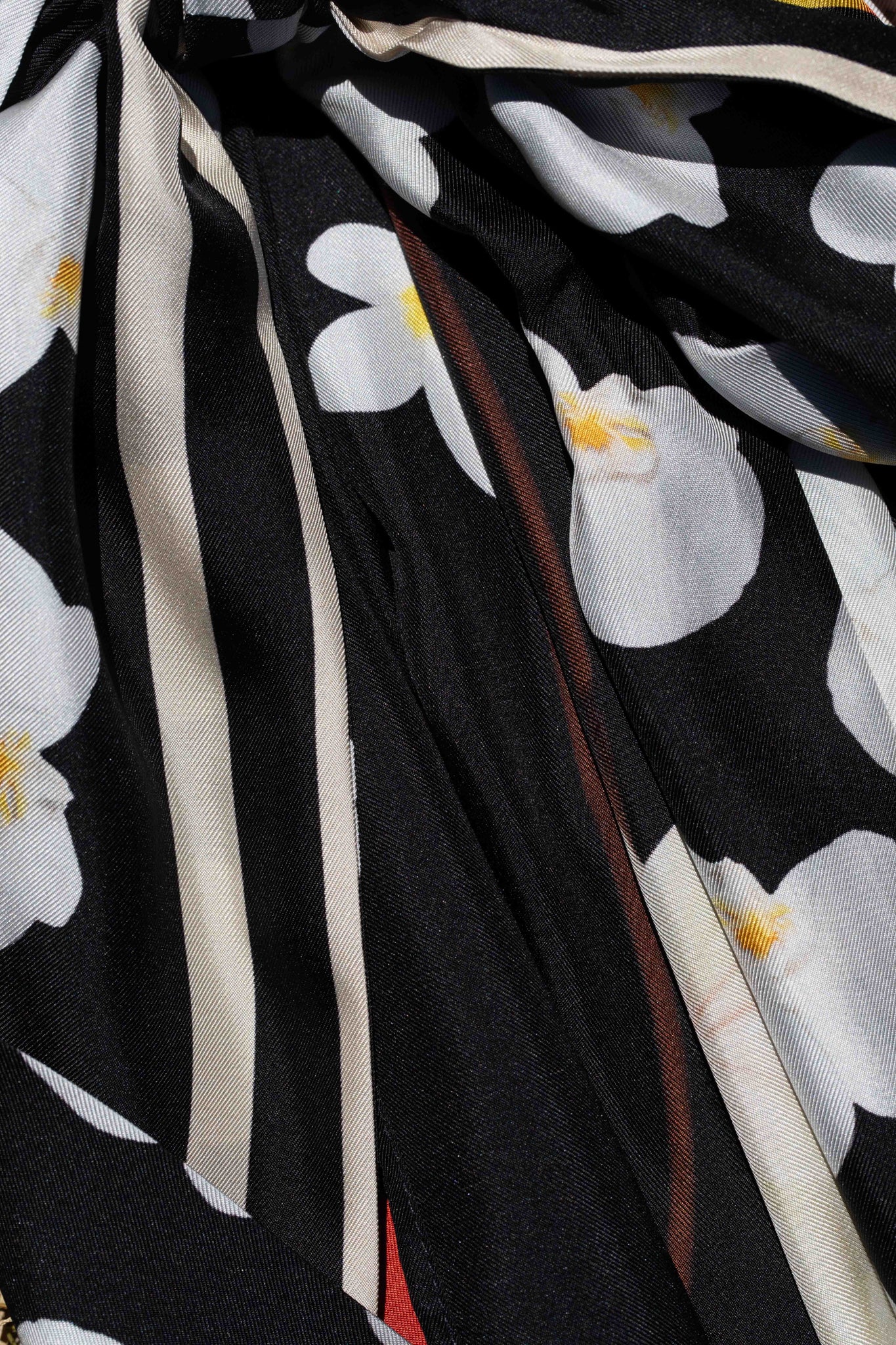 Chic black silk island kimono robe with dramatic Hawaiian floral artwork inspired by sophisticated coastal escapes and elevated vacation dressing.