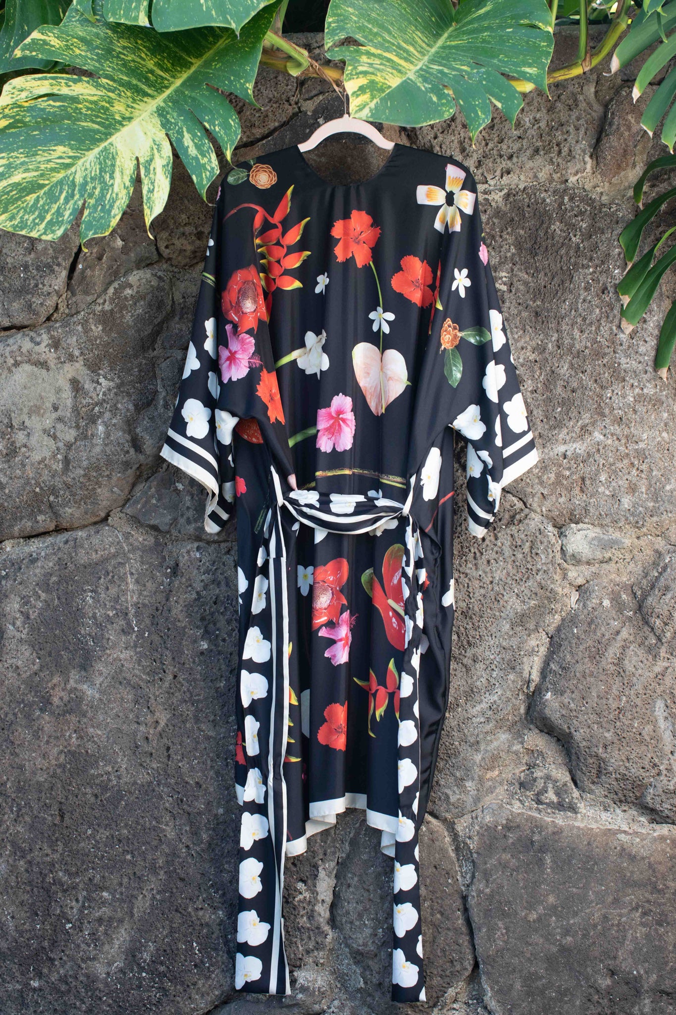 Couture-inspired black silk kimono robe with bold tropical Hawaiian florals and elevated botanical design by Lola Pilar.