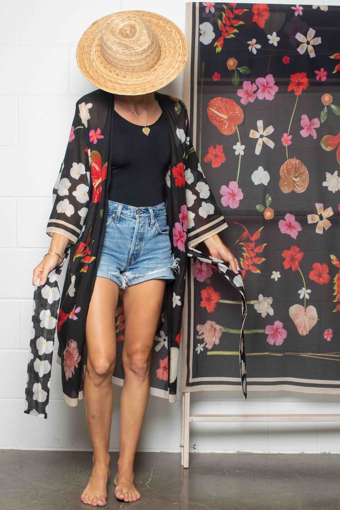 Elevated resortwear kimono robe in soft black cotton with statement island botanical print inspired by luxury Hawaii escapes and effortless vacation dressing.