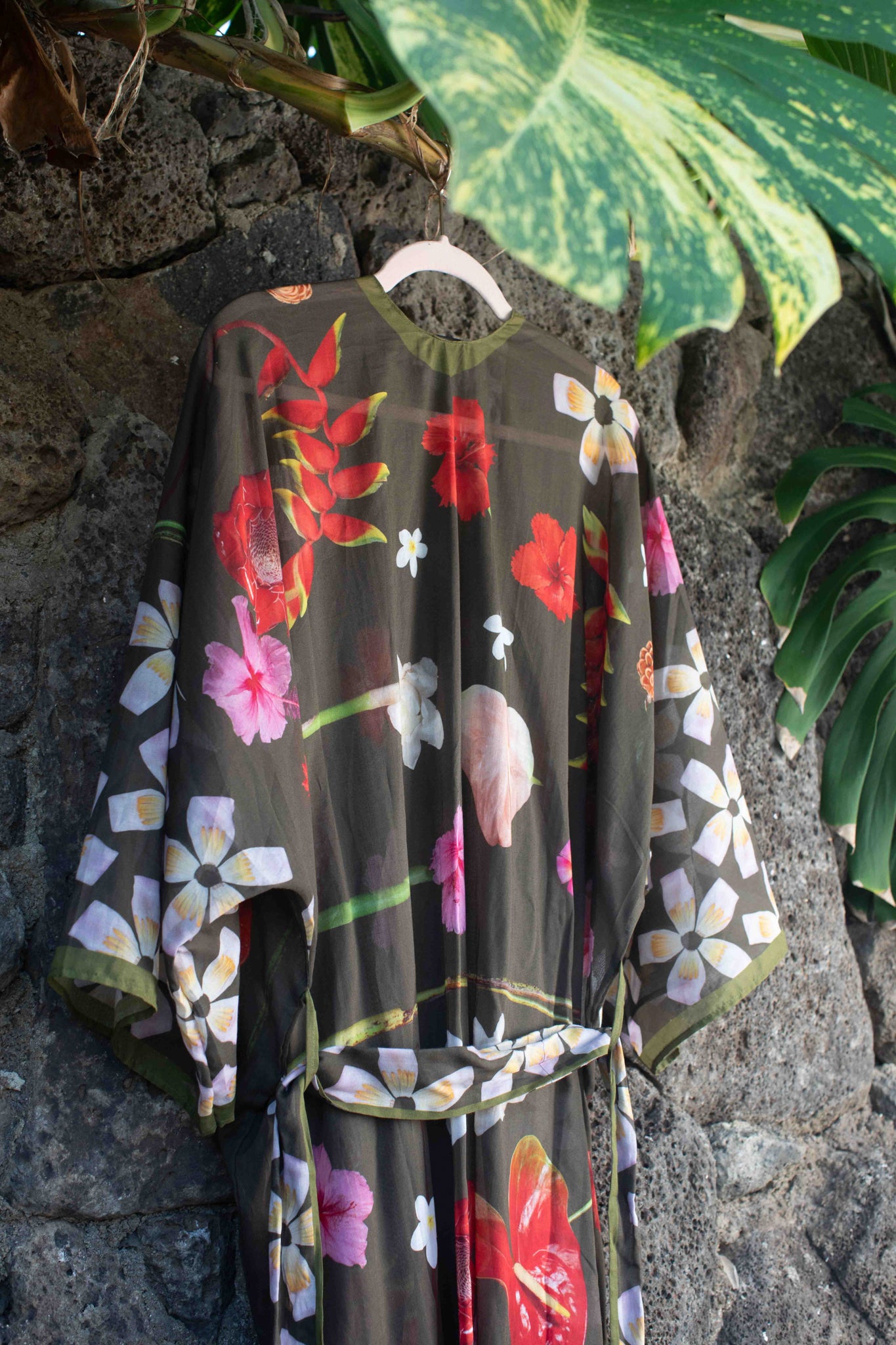 Hawaii-designed floral kimono robe with moss green backdrop and colorful tropical flowers, made in Italy for elegant island-inspired style Lola Pilar.

