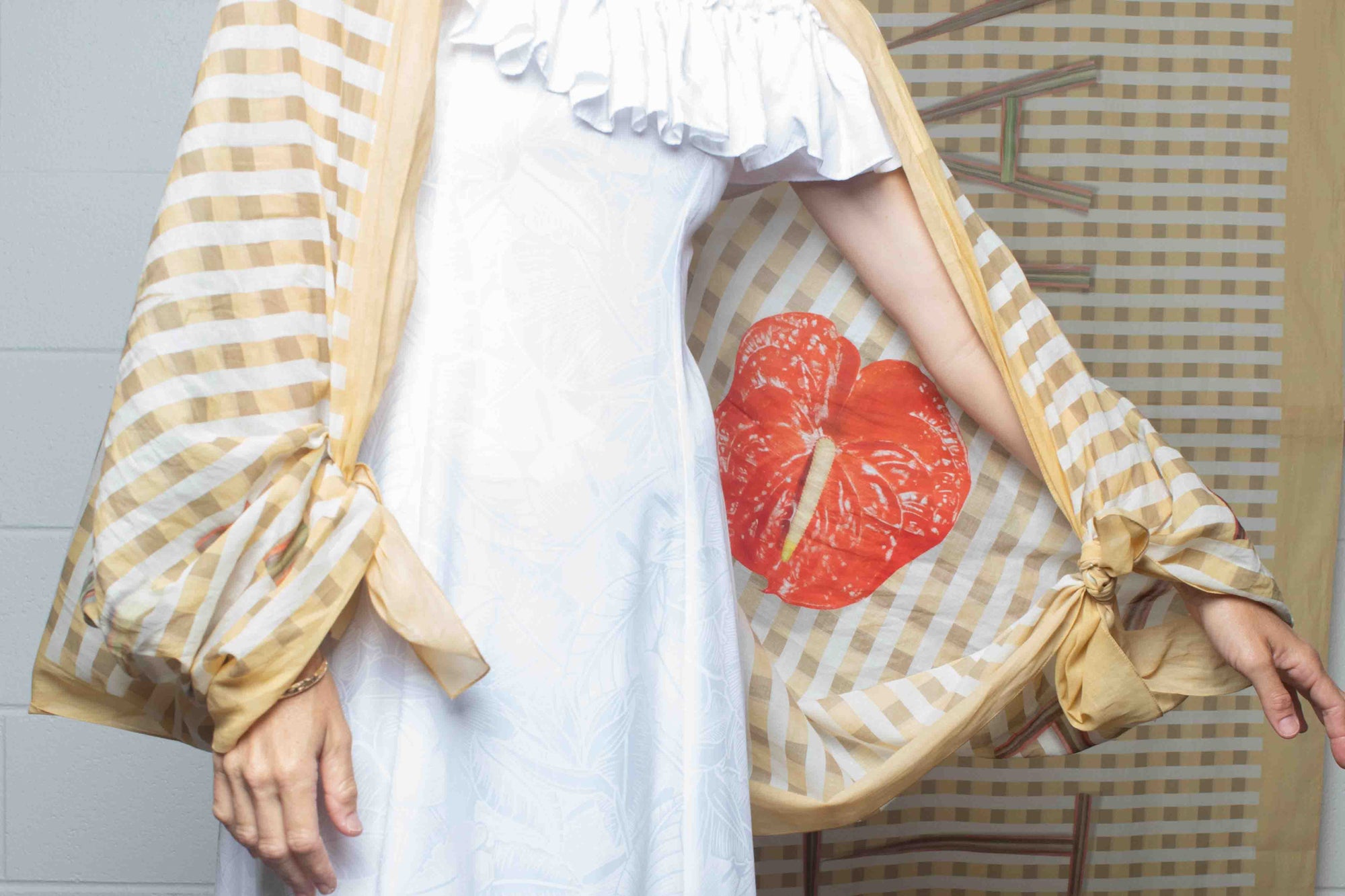 Yellow and white checkered travel scarf made in Italy and designed in Hawaii with “I Love Hawaii” artwork and tropical red anthurium detail Lola Pilar