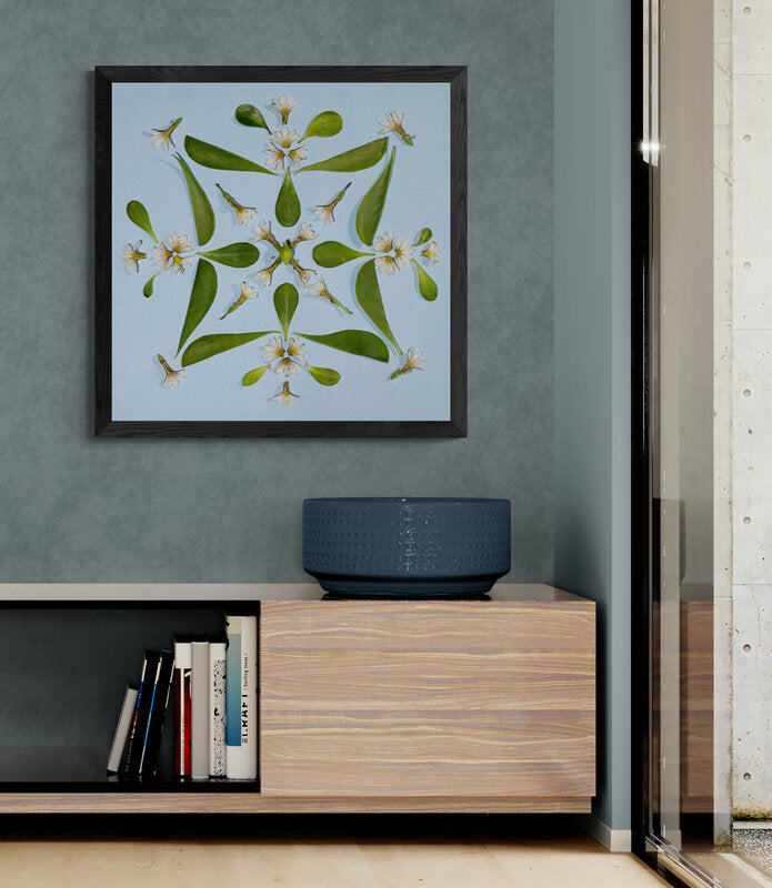 Hawaii floral framed art print on a wall above a wooden shelf with books and a decorative bowl Hawaiian fine art photo Lola Pilar Hawaii
