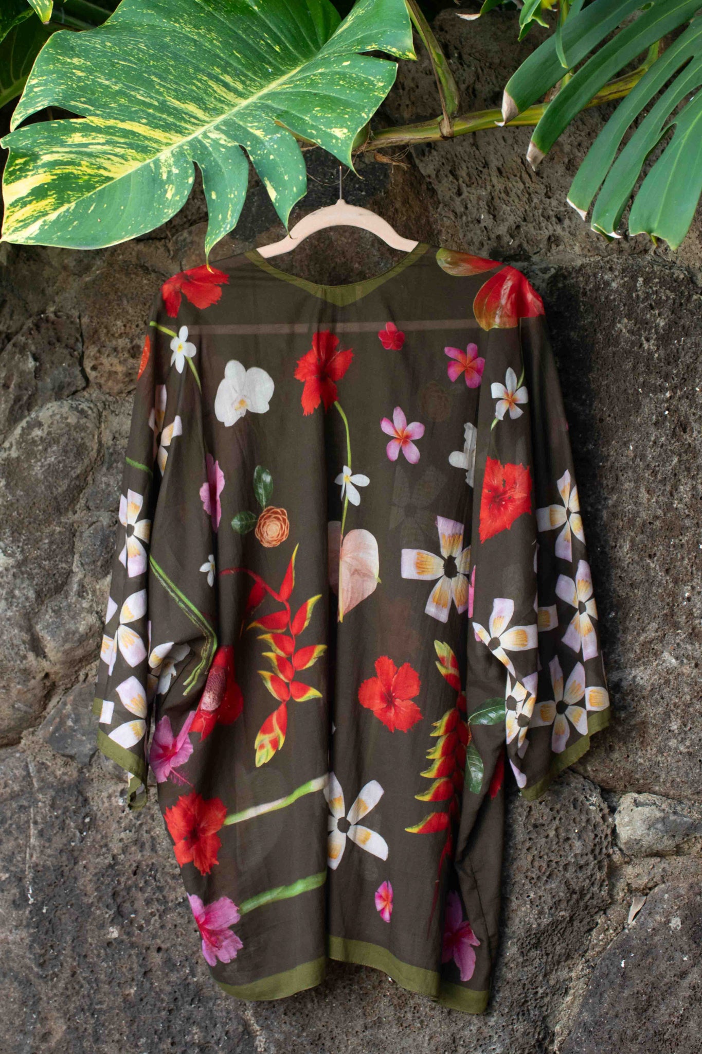 Italian-made moss green cotton kimono featuring lush tropical blooms and flowing one-size silhouette by Lola Pilar.