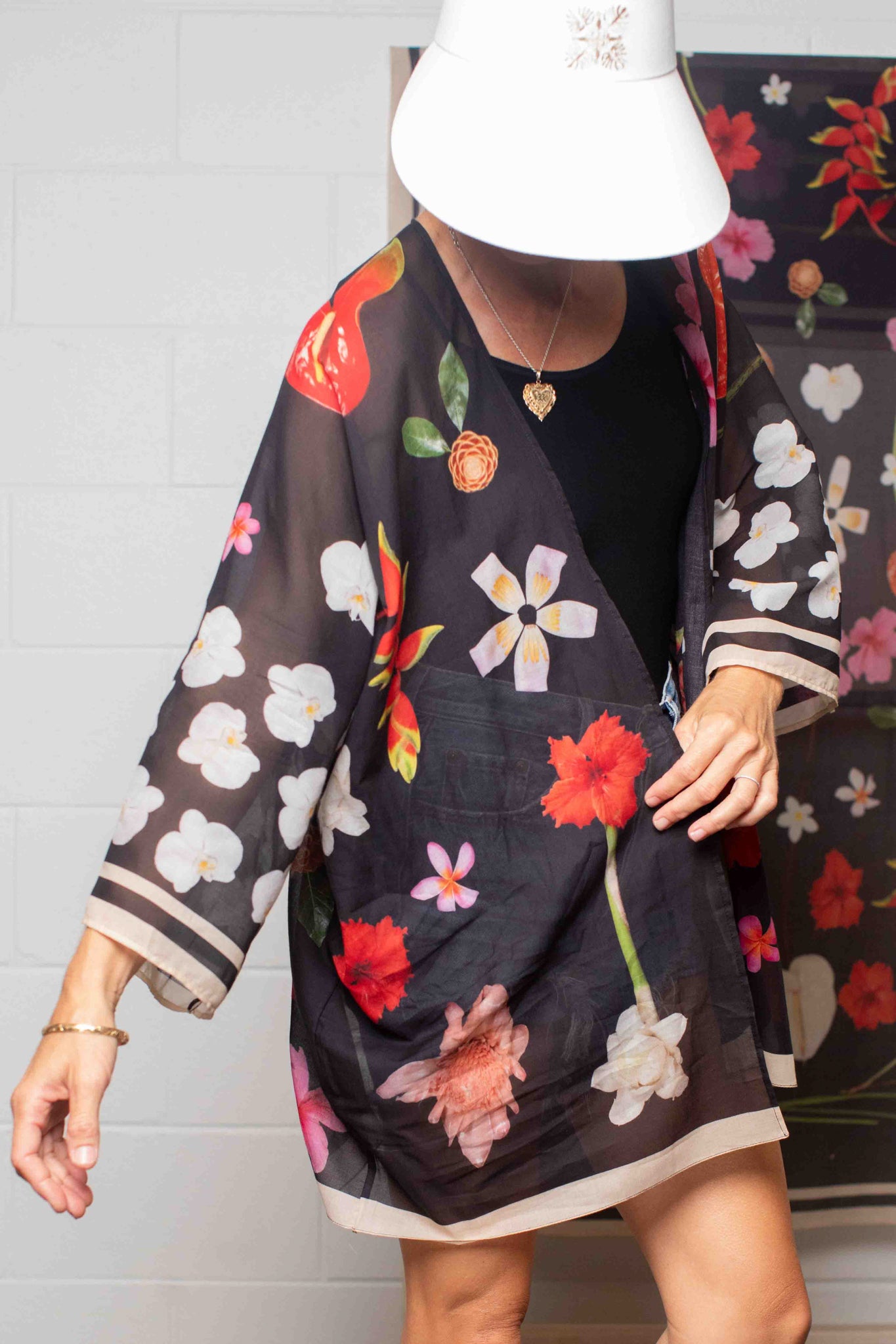 Italian-made black cotton kimono shirt featuring lush tropical botanical artwork designed in Hawaii for elevated travel and vacation style.