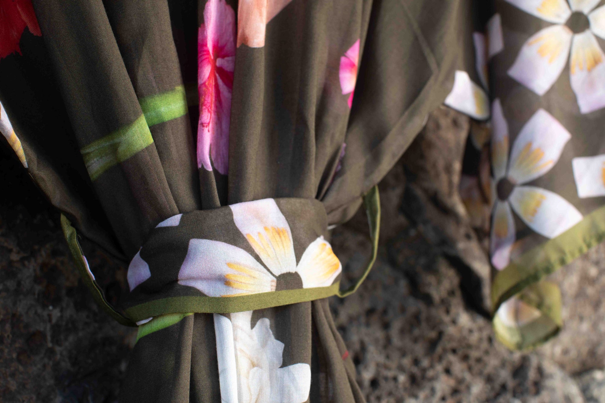 Italian-made kimono robe designed in Hawaii with lush tropical floral artwork on moss green featuring hibiscus, plumeria, and heliconia blooms.