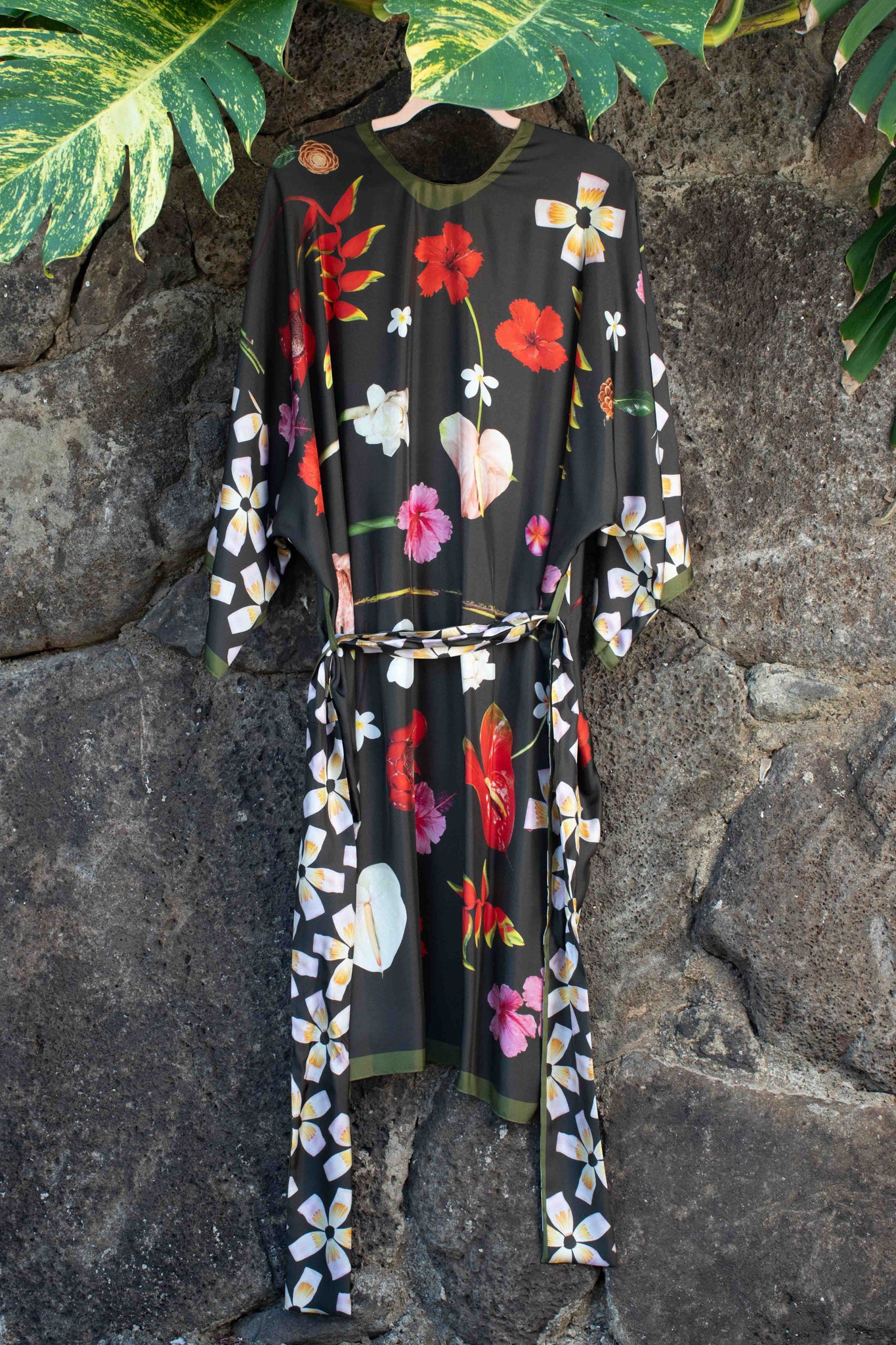 Italian-made moss green silk robe with sophisticated Hawaiian botanical print by Lola Pilar, blending refined travel fashion with tropical artistry.