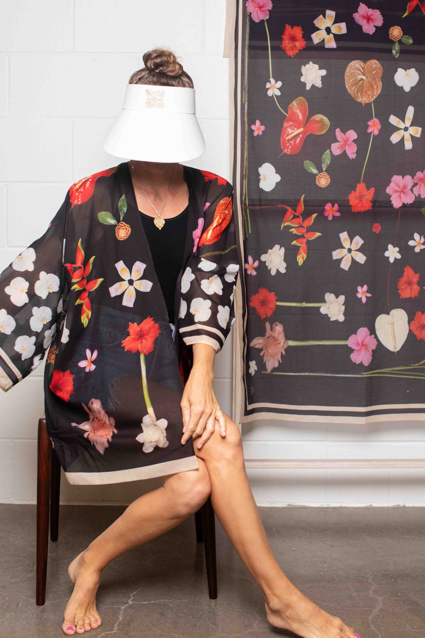 Luxe black cotton kimono top with colorful botanical Hawaiian print designed for effortless travel, resort, and coastal styling.