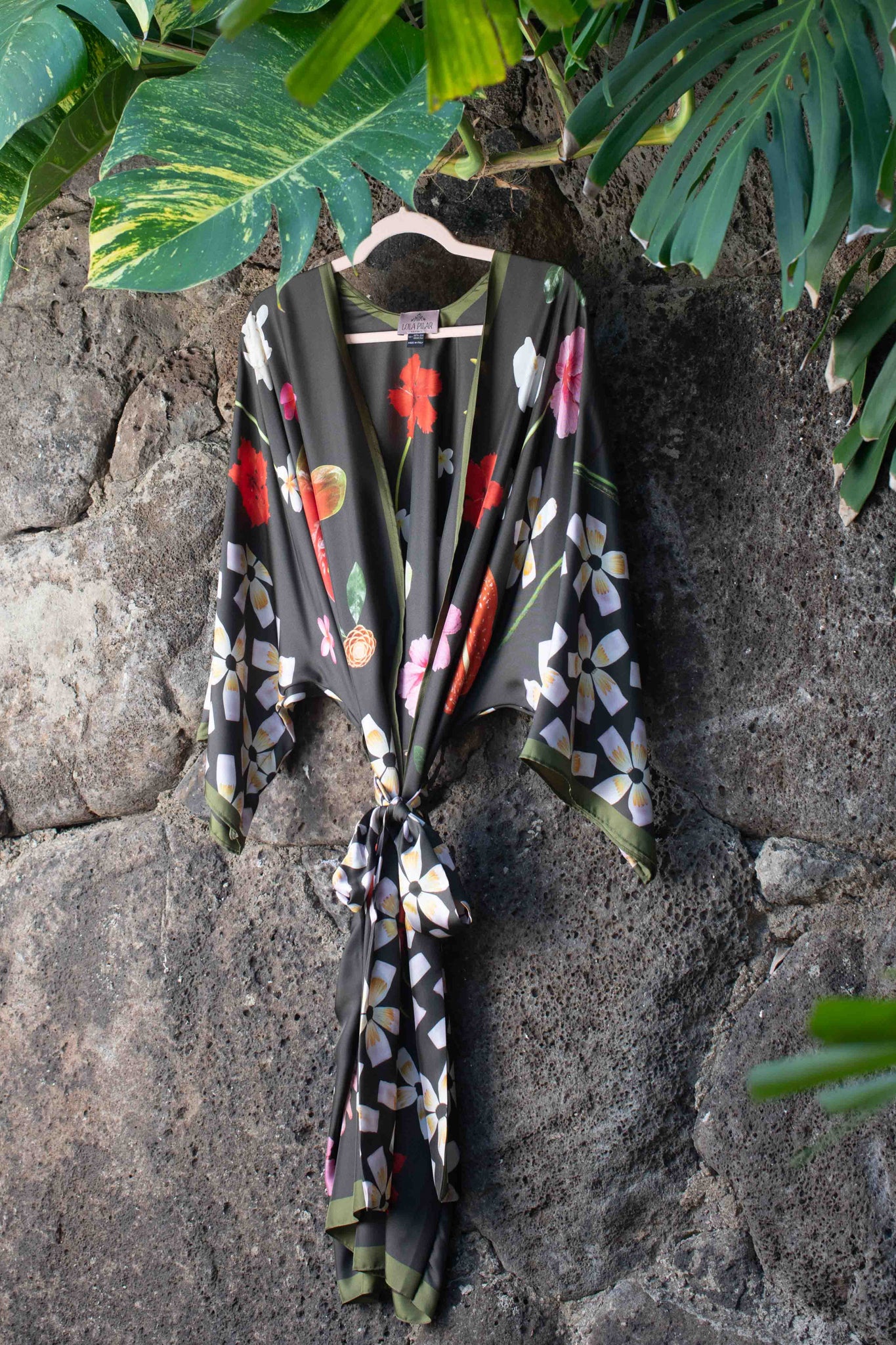 Luxury moss green silk kimono robe with vibrant tropical Hawaiian flowers in rich pink, red, yellow, and white tones for elegant island-inspired style.