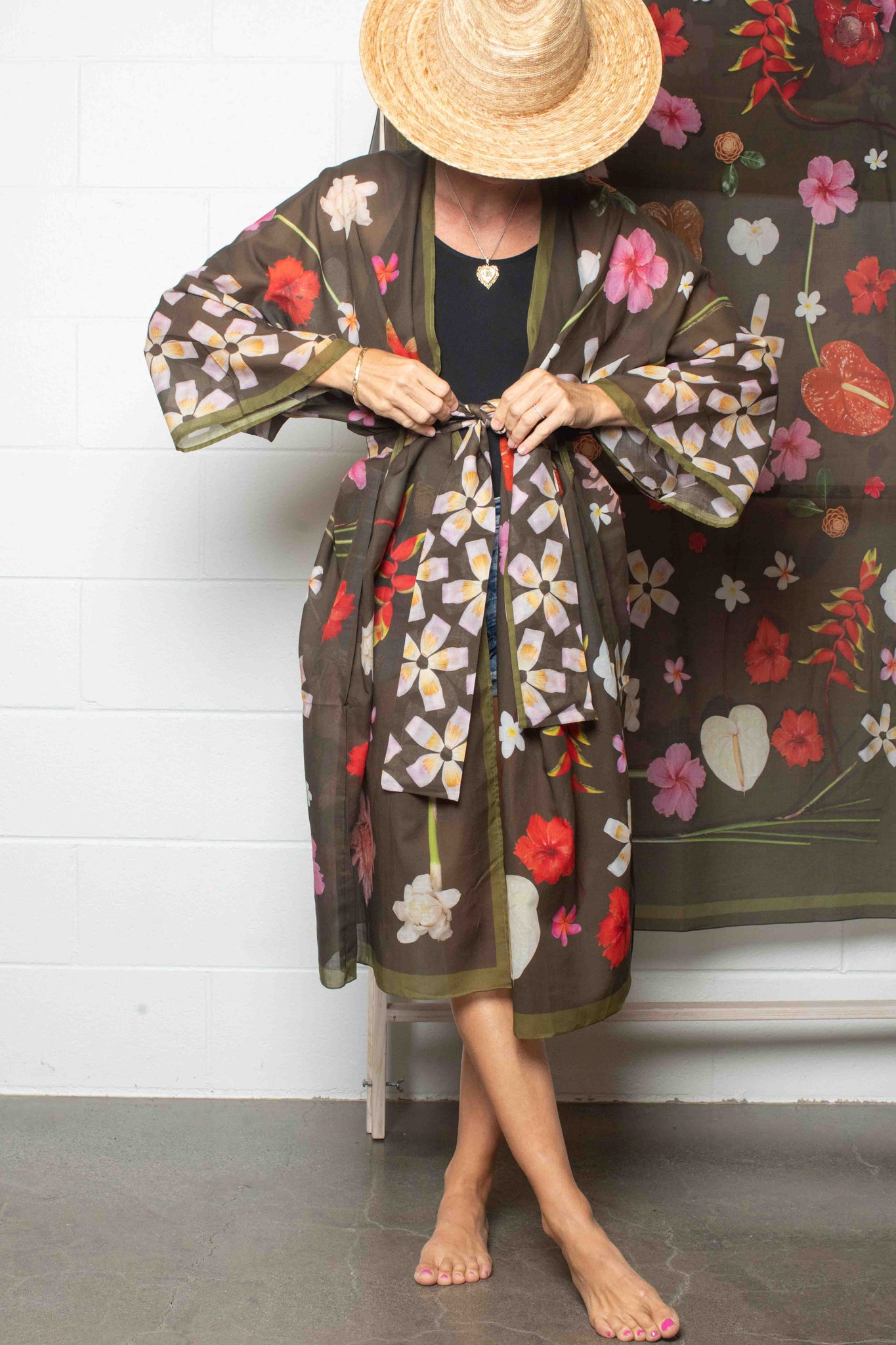 Lola Pilar kimono robe with moss green background featuring hibiscus, torch ginger, hanging heliconia, plumeria, and banana flowers in vibrant tropical colors, made in Italy and designed in Hawaii.
