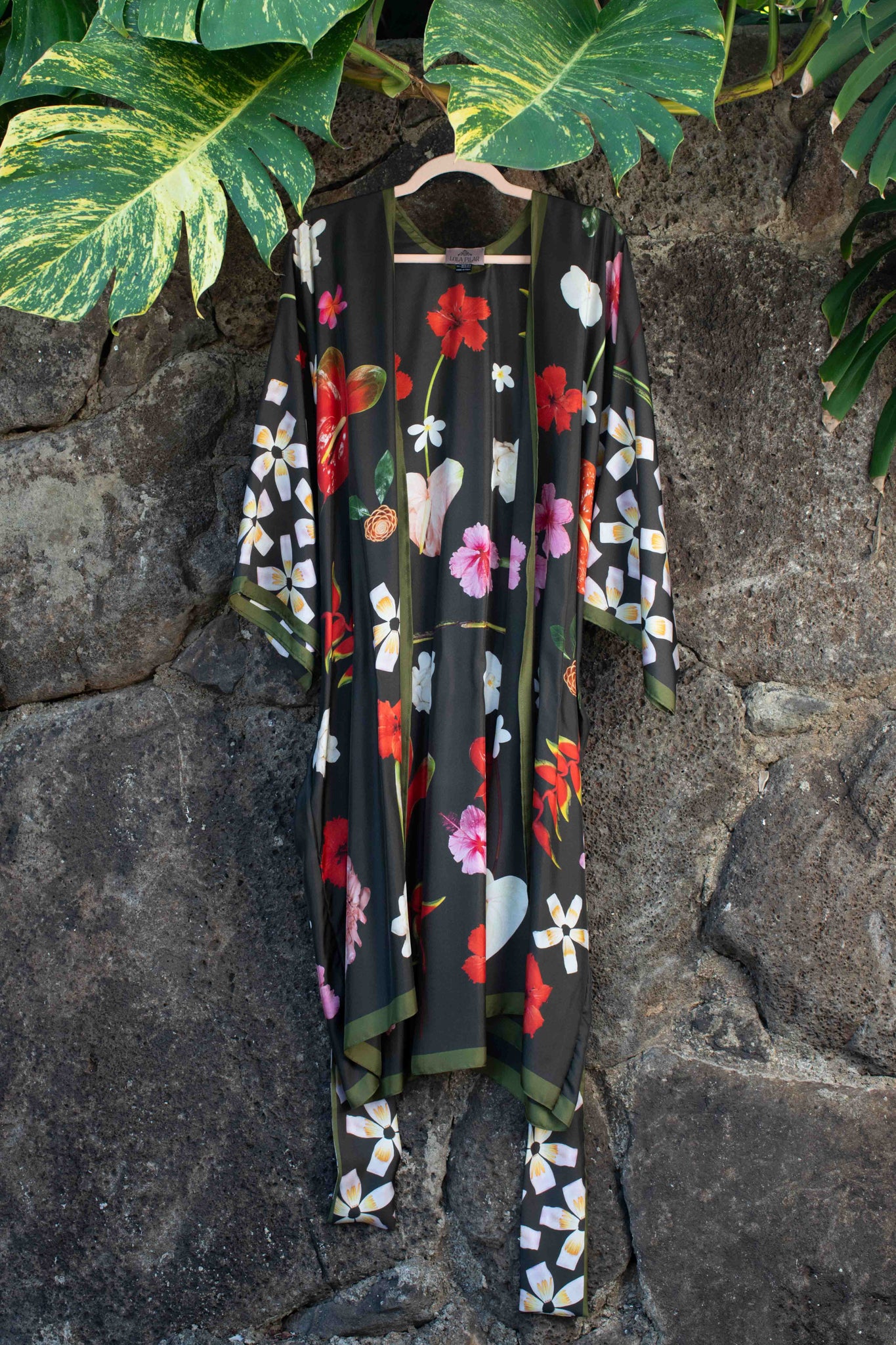Moss green silk robe adorned with heliconia, hibiscus, banana flowers, and plumeria in a refined Hawaii-inspired floral pattern.