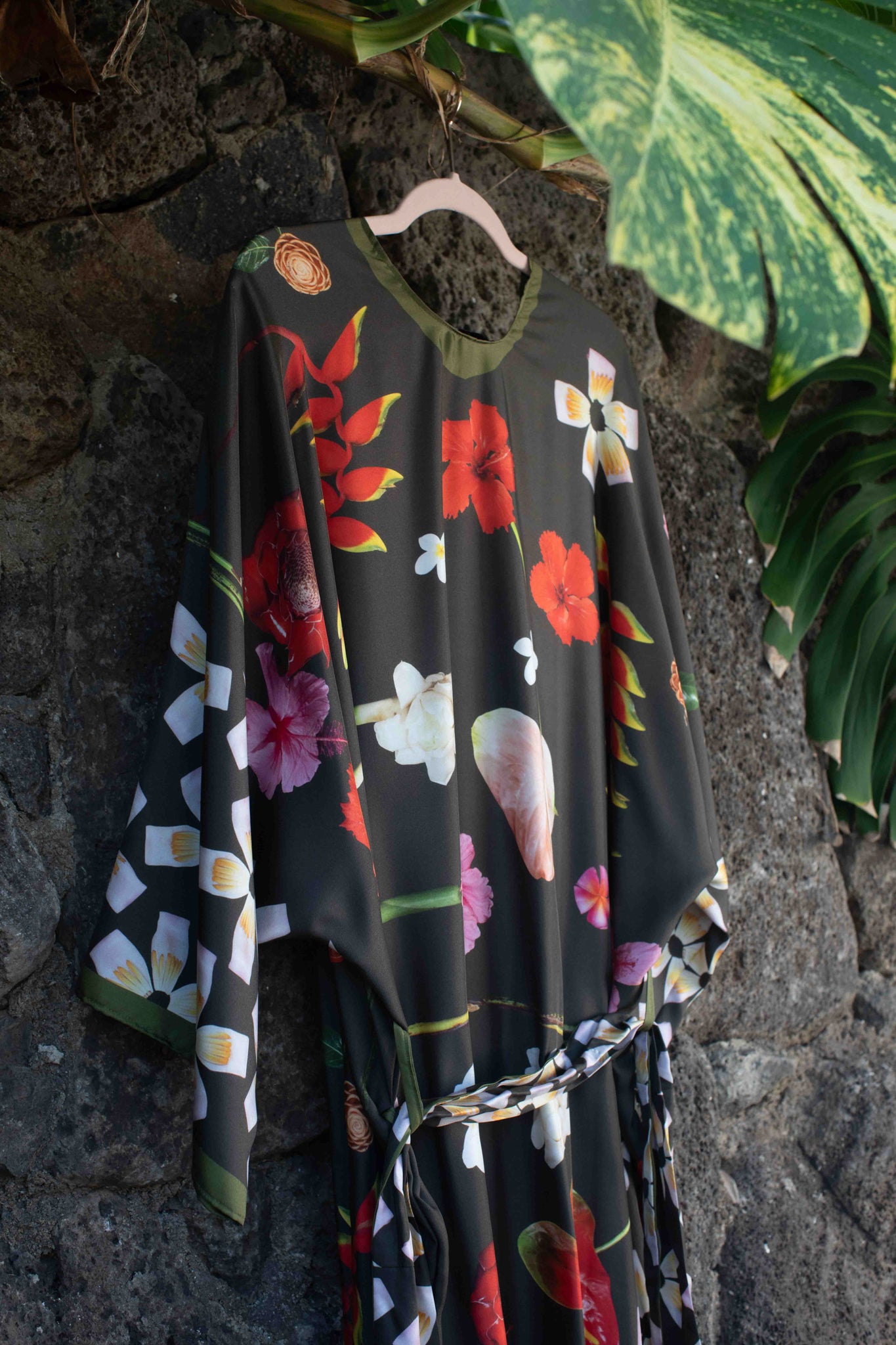 Premium moss green floral silk robe featuring hibiscus, hanging heliconia, torch ginger, and plumeria in a striking tropical composition, Lola Pilar.