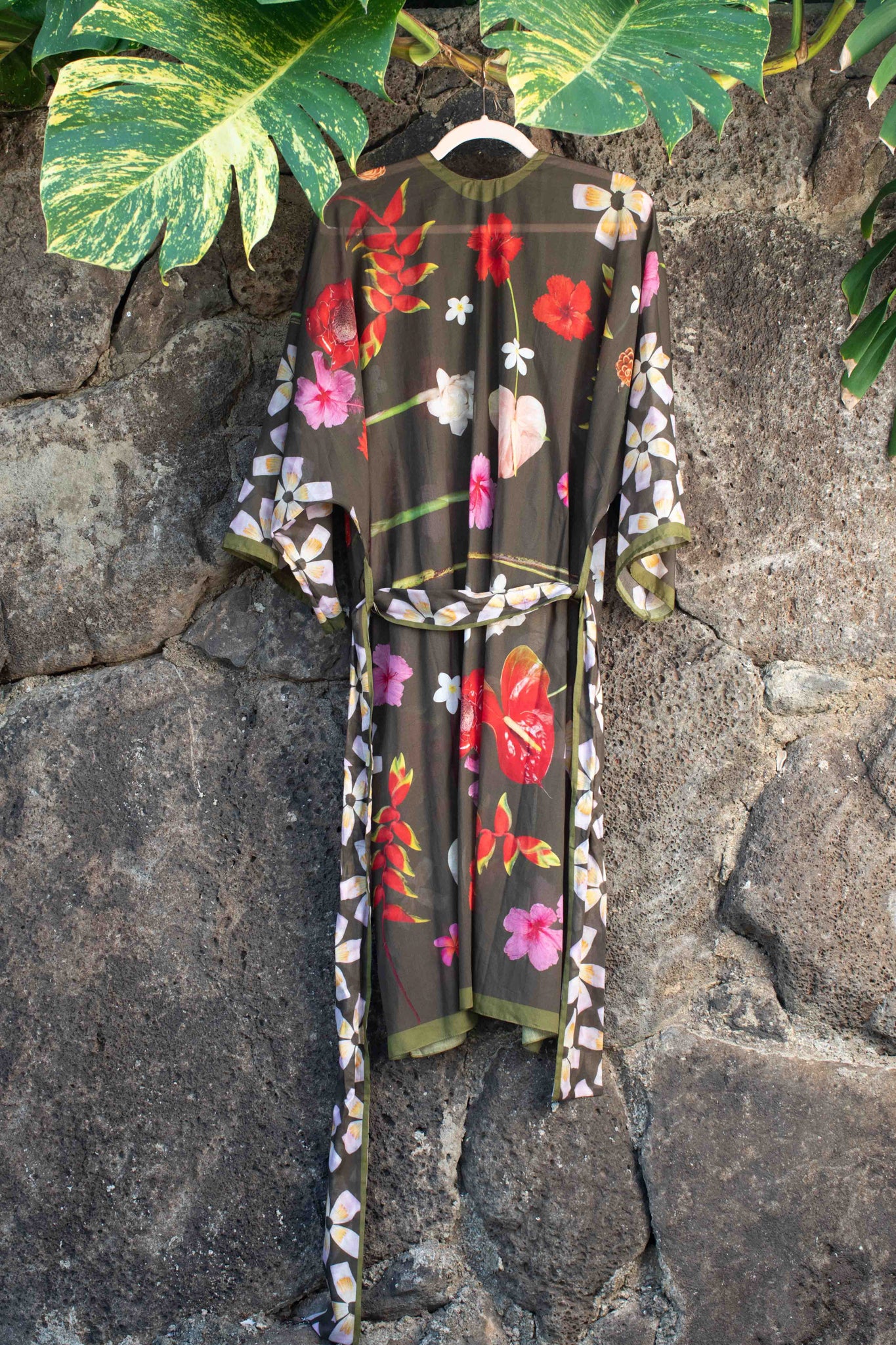 Tropical botanical kimono wrap with moss green floral design including hibiscus, banana flowers, hanging heliconia, and torch ginger by Lola Pilar.