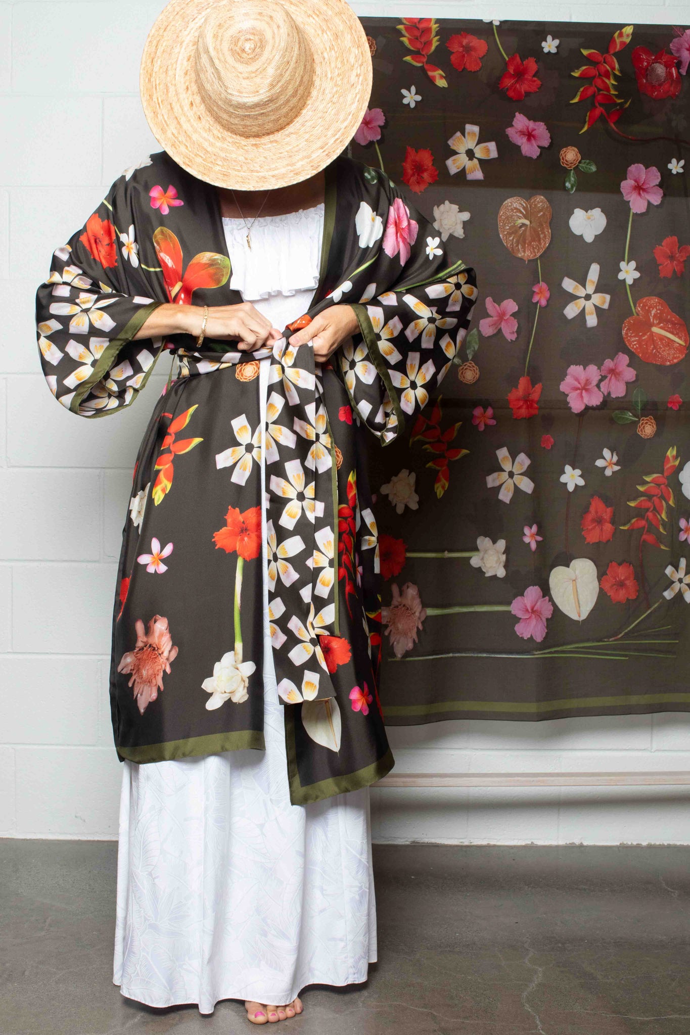 Tropical elegance silk kimono robe with moss green backdrop and statement floral design featuring hibiscus, plumeria, heliconia, and torch ginger.