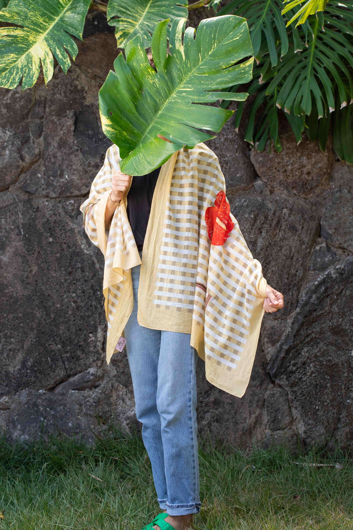 Tropical sarong in yellow and white palaka checks with “I Love Hawaii” lettering and vibrant red anthurium floral detail.