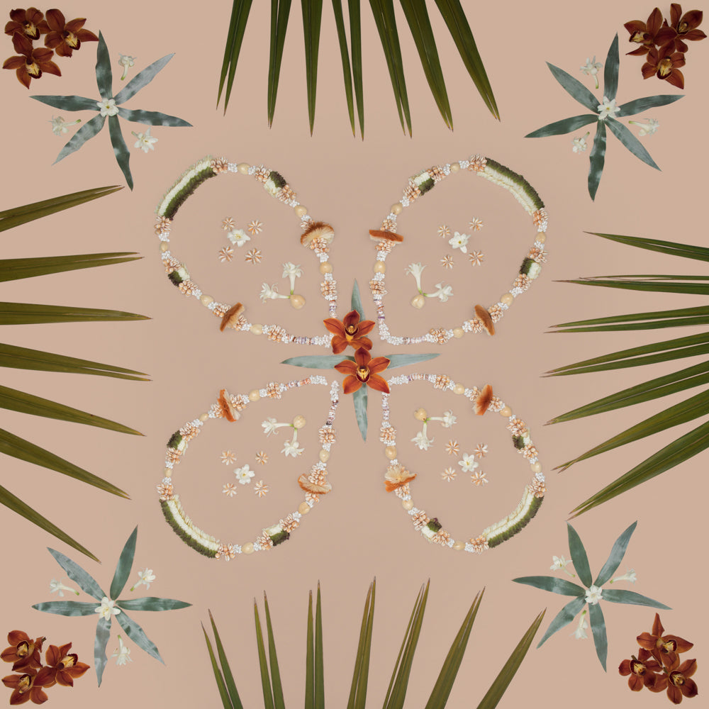 live a lei life leis and fan palm tuberose orchids to create a symmetrical photo