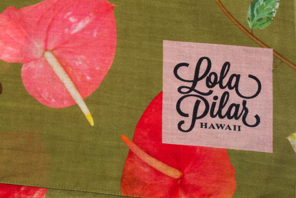 lola pilar hawaii pink logo printed on green cotton sarong