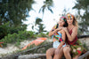 two beautiful ladies rocking lola pilar scarves and sarongs in the hair