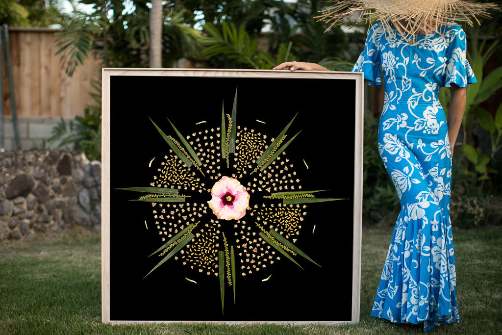 women stands next to a large format photograph in a 42x42 foot frame