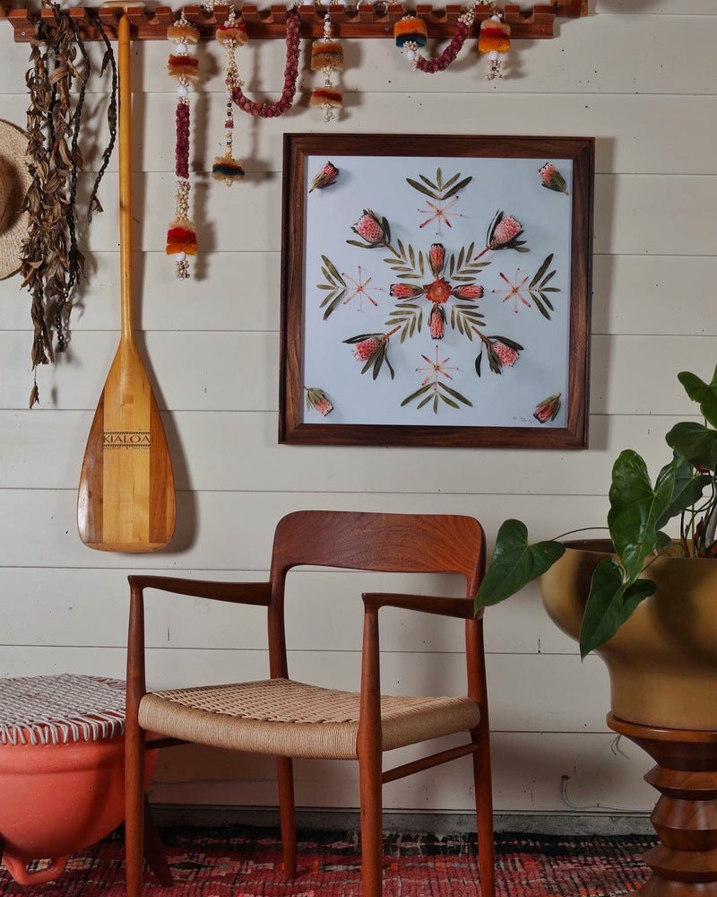 monkey pod frame with a photograph of protea plants in a home setting