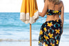 lola pilar hawaii sarong overlooking the pacific ocean in hawaii with yellow umbrella