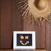 8x10 photograph of a banana smile with hibiscus eyes