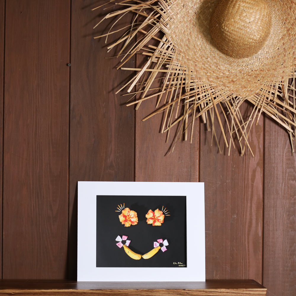 8x10 photograph of a banana smile with hibiscus eyes
